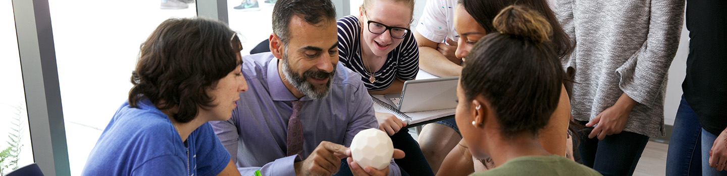 Professor Katsioloudis & ODU students work together in a classroom inside the new education building.